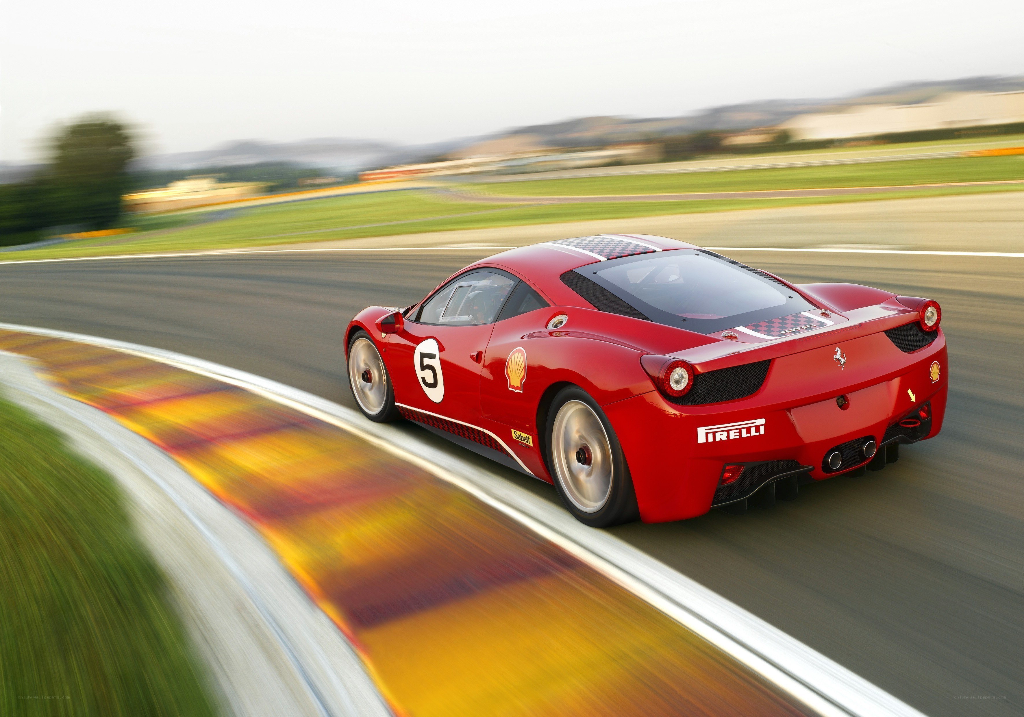 Red Ferrari on a racetrack