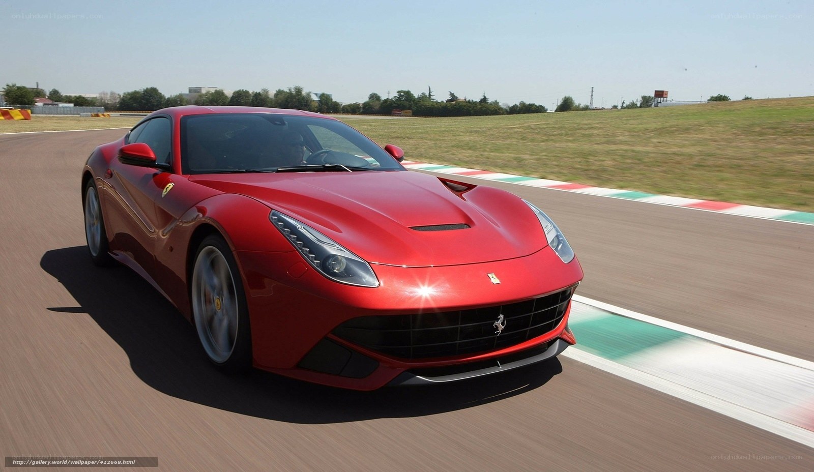 Red Ferrari on a racetrack