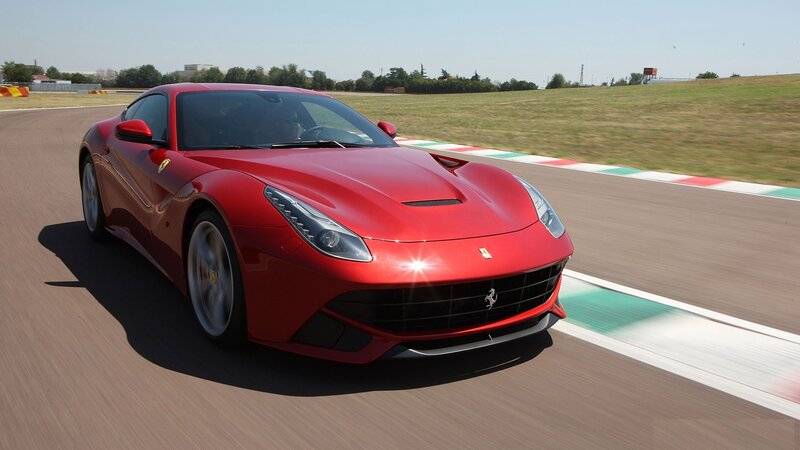 Red Ferrari on a racetrack