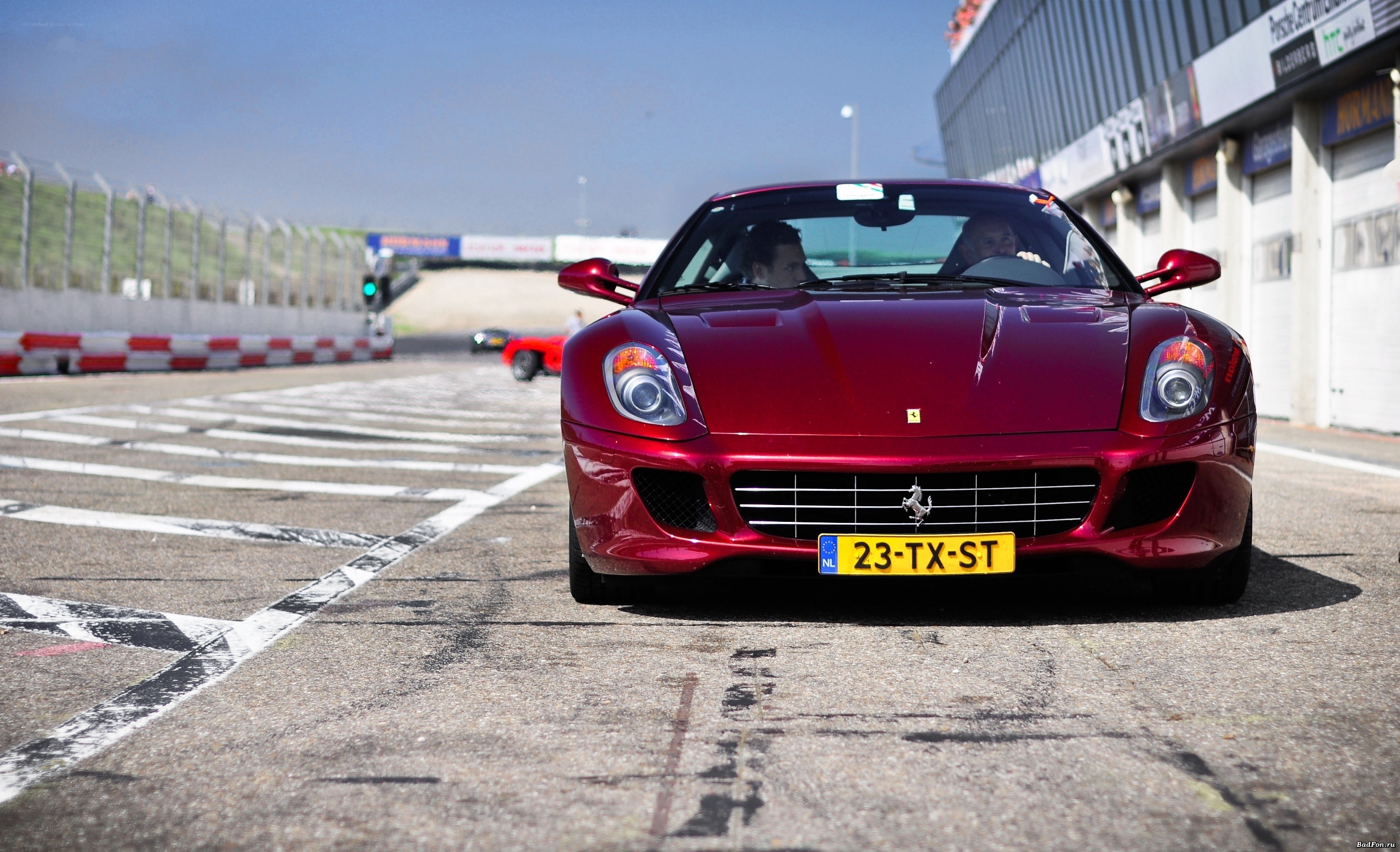 Red Ferrari on a racetrack
