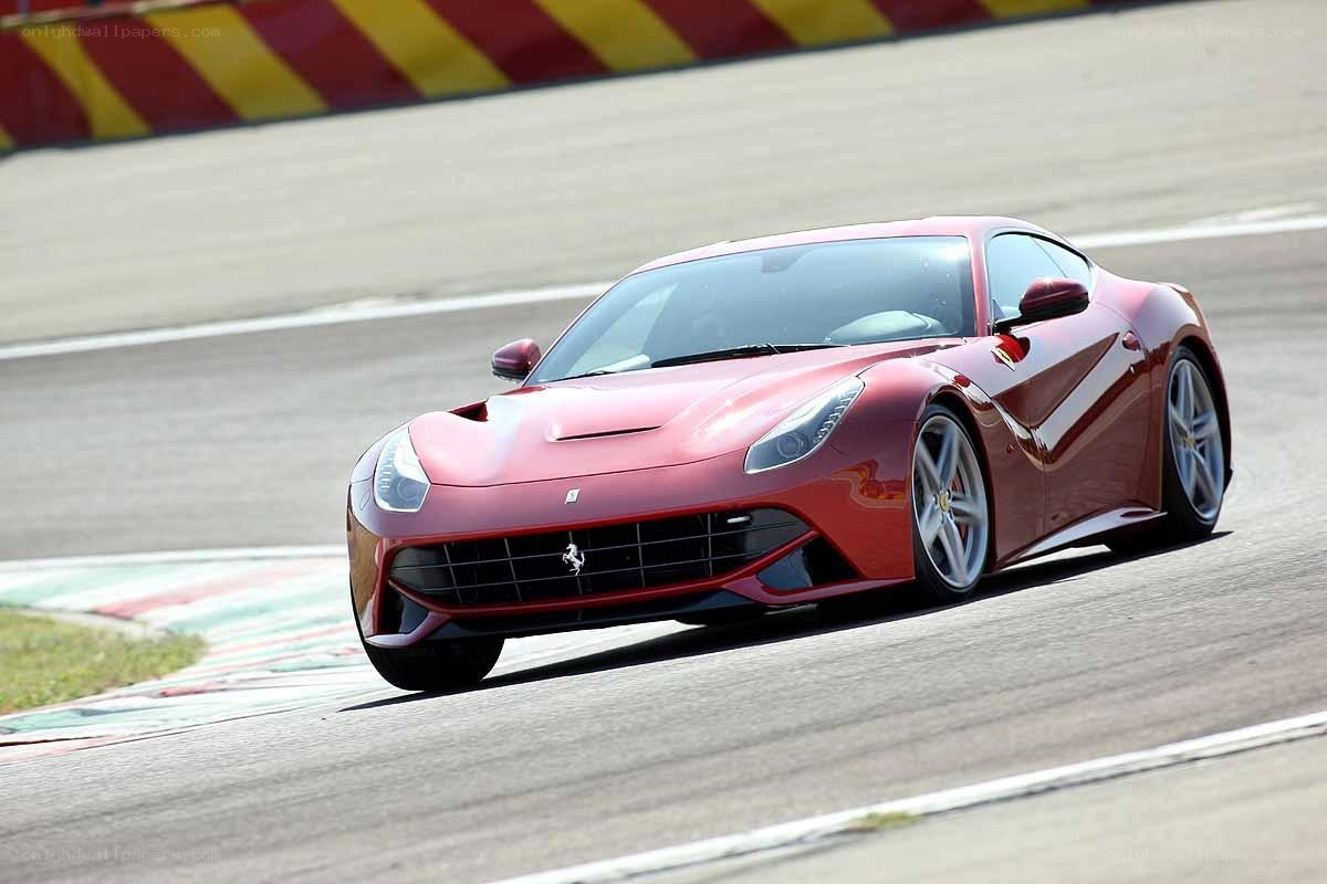 Red Ferrari on a racetrack