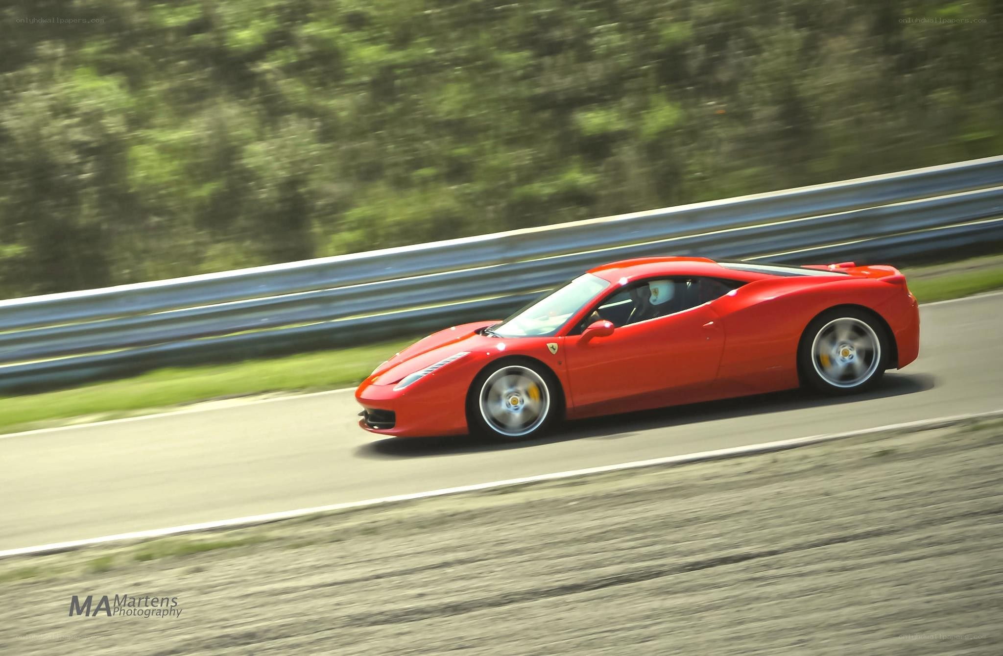 Red Ferrari on a racetrack