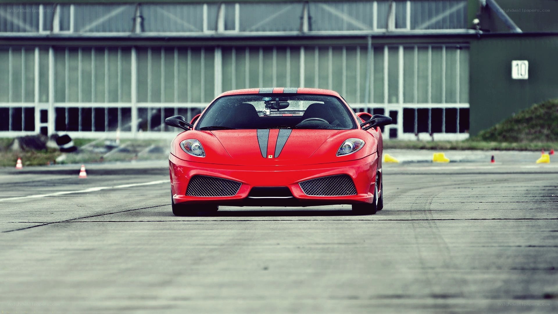 Red Ferrari on a racetrack