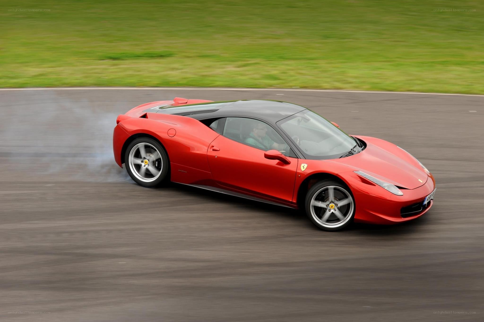 Red Ferrari on a racetrack