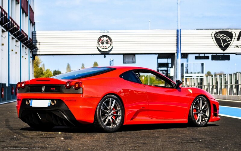 Red Ferrari on a racetrack
