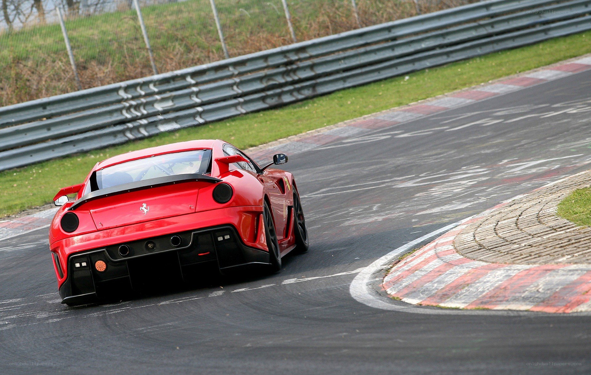 Red Ferrari on a racetrack