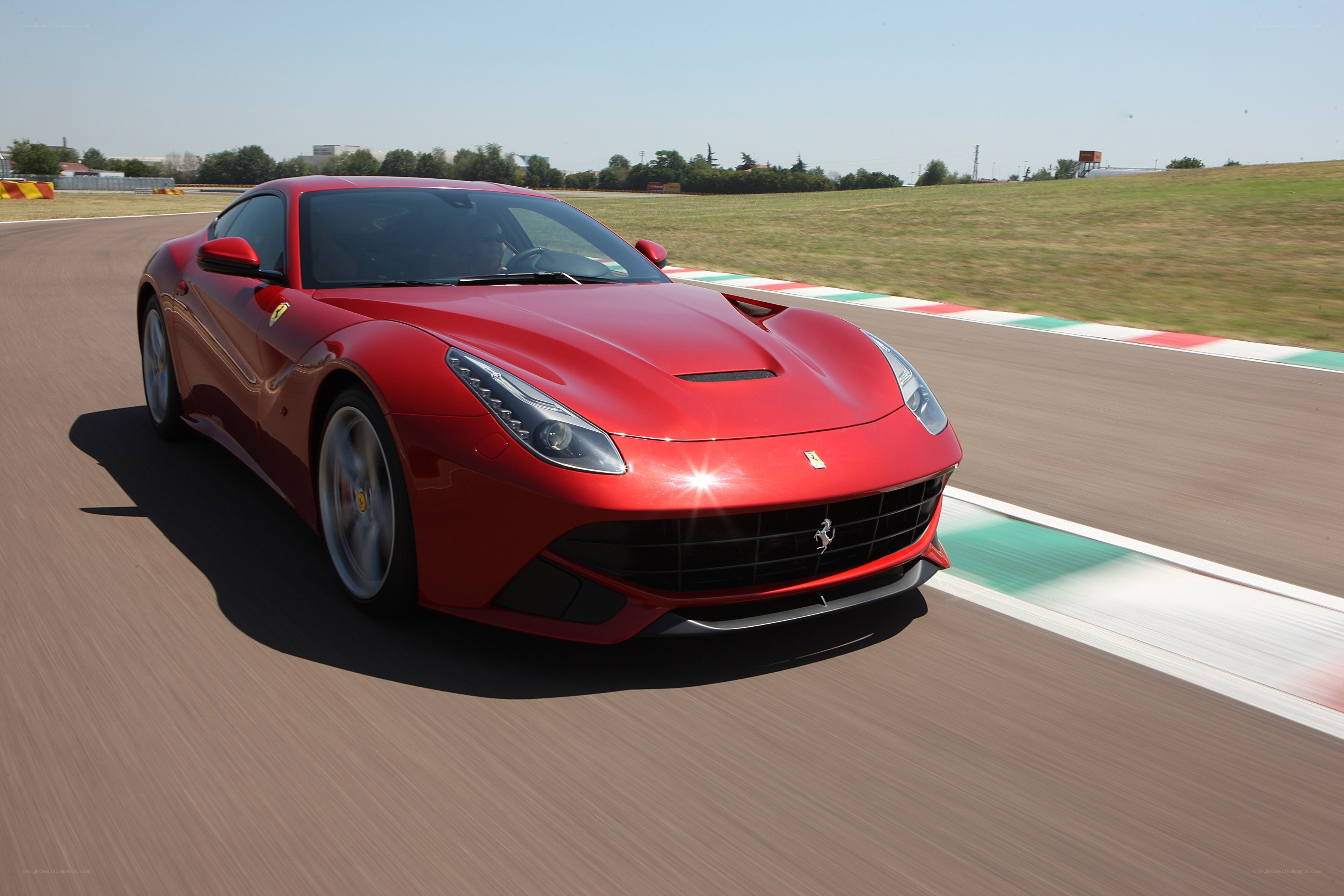 Red Ferrari on a racetrack