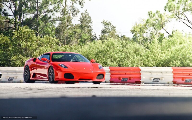 Red Ferrari on a racetrack