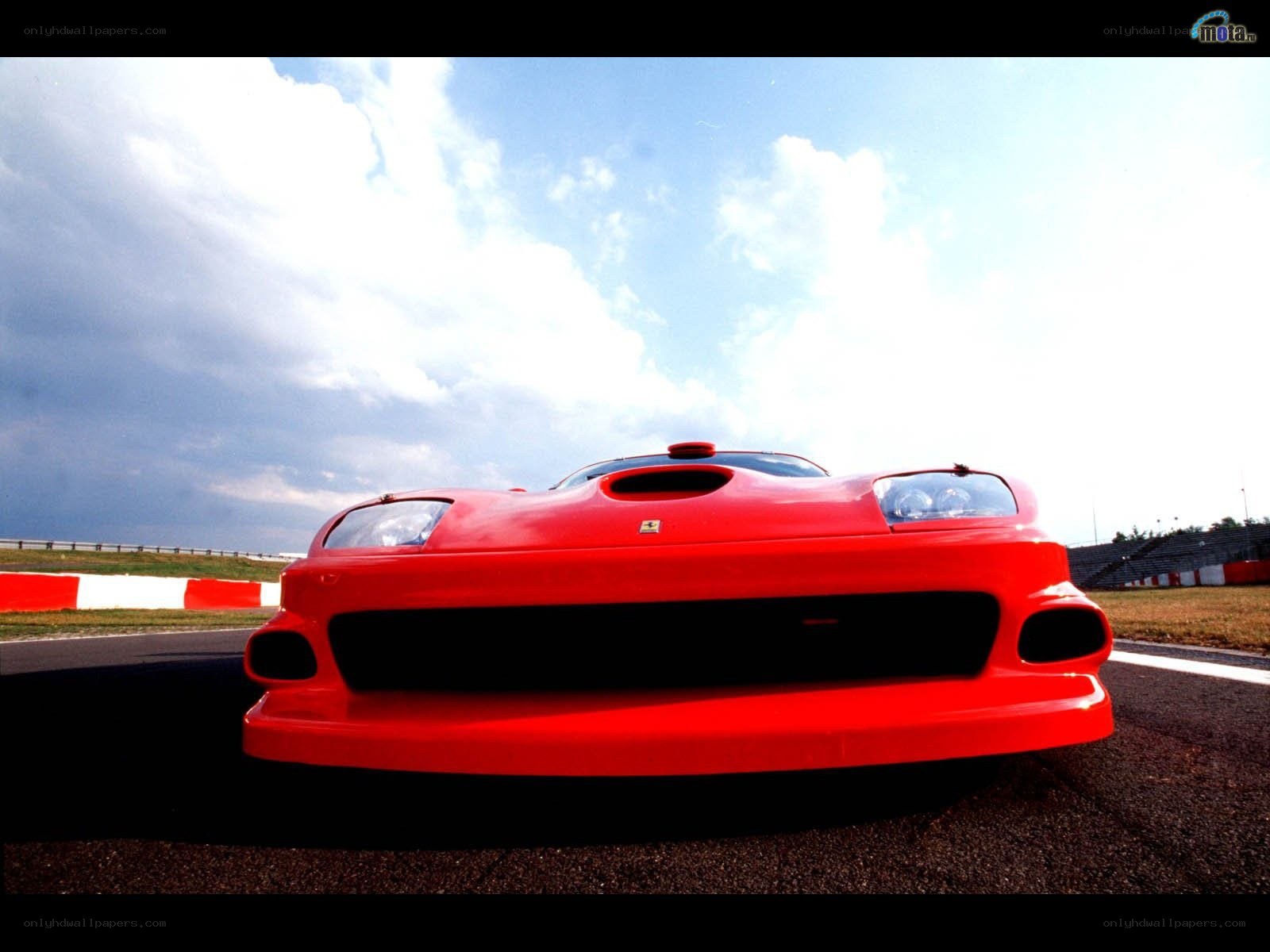 Red Ferrari on a racetrack