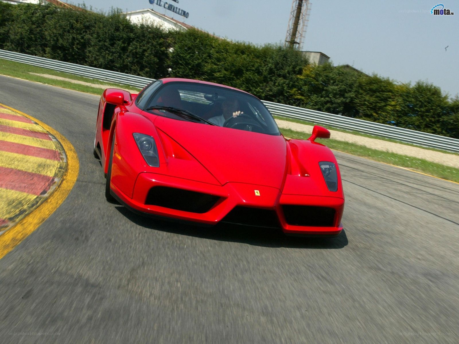 Red Ferrari on a racetrack