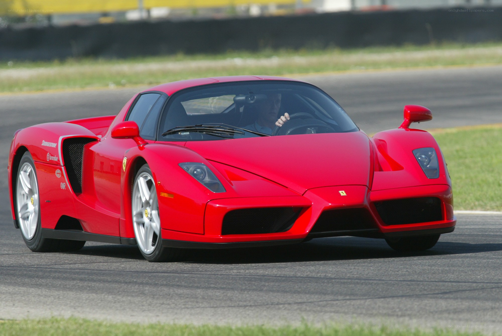 Red Ferrari on a racetrack
