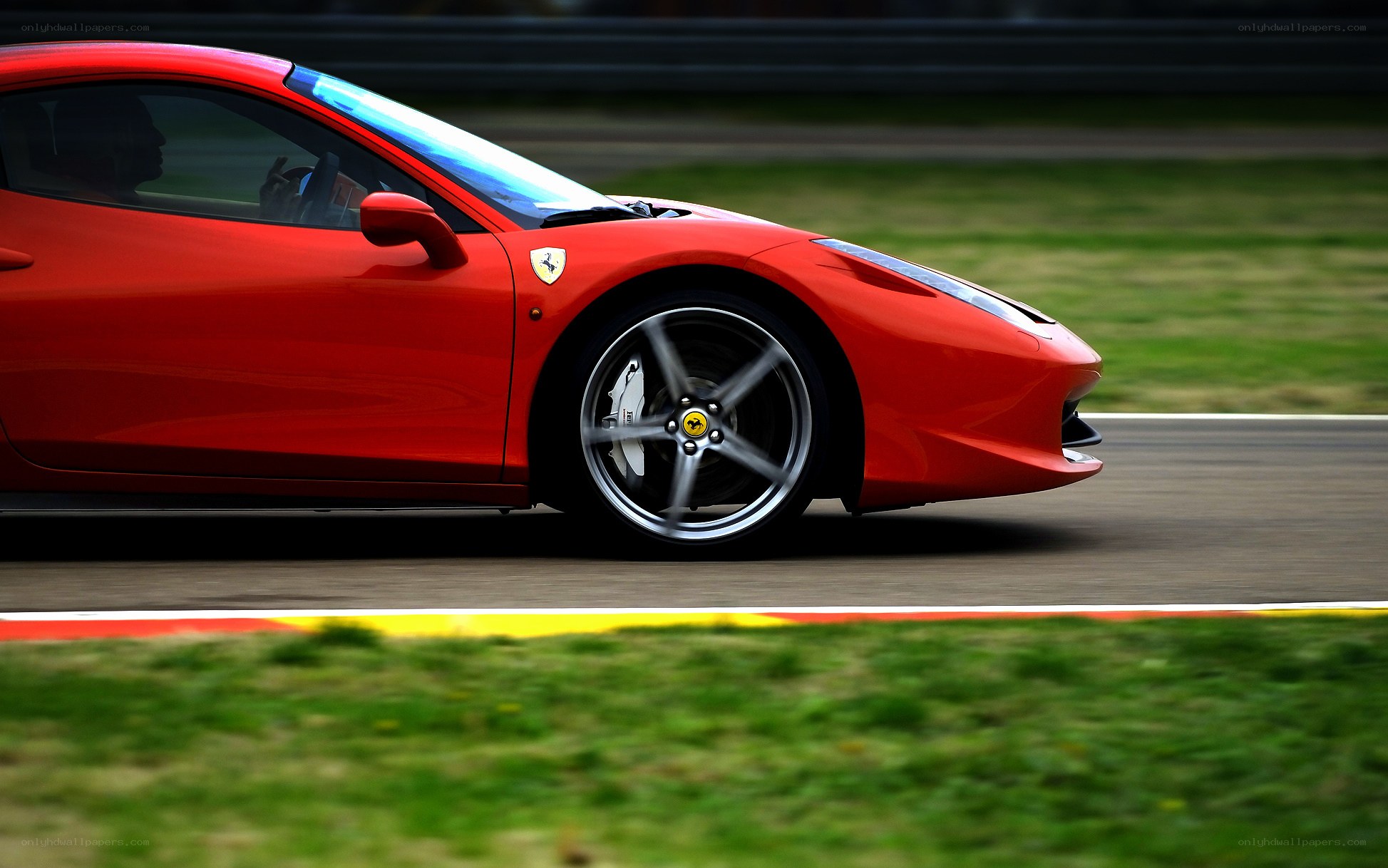 Red Ferrari on a racetrack