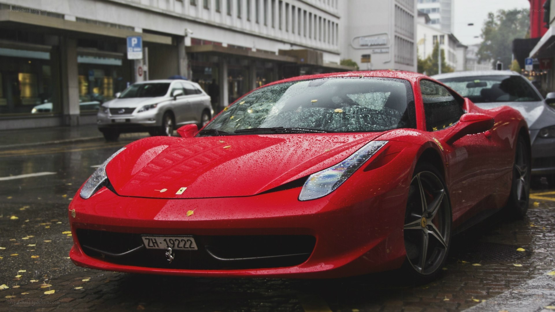 Red Ferrari on a rainy street