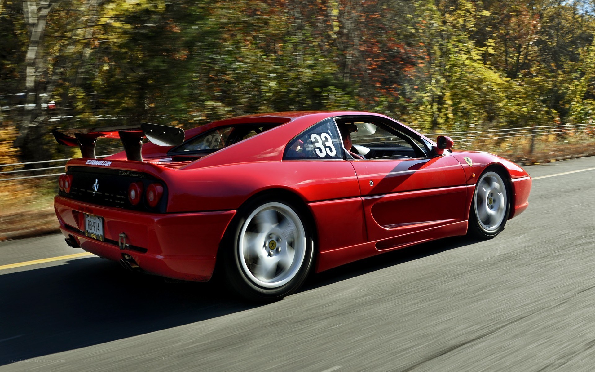 Red Ferrari on a road