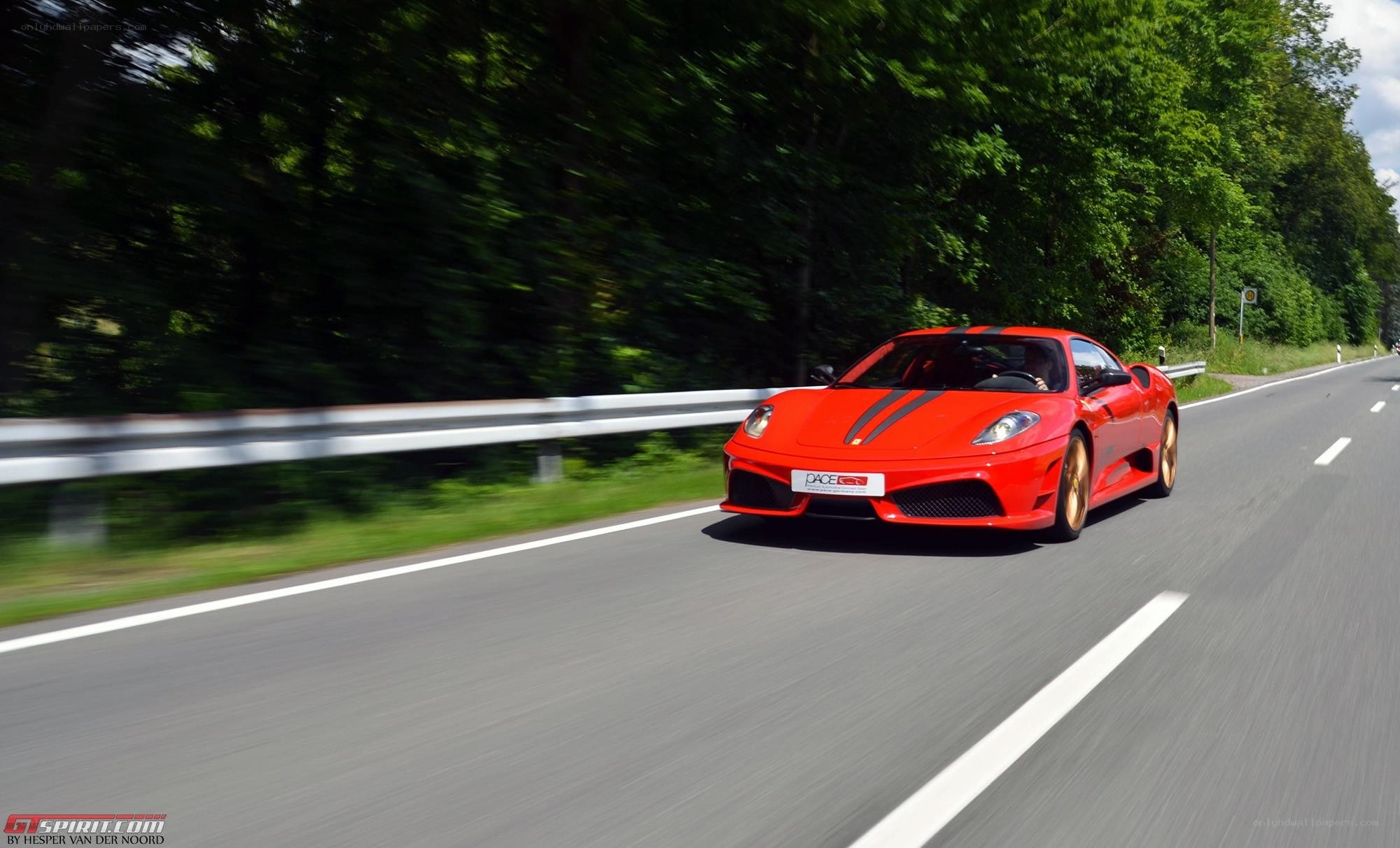 red ferrari on a road