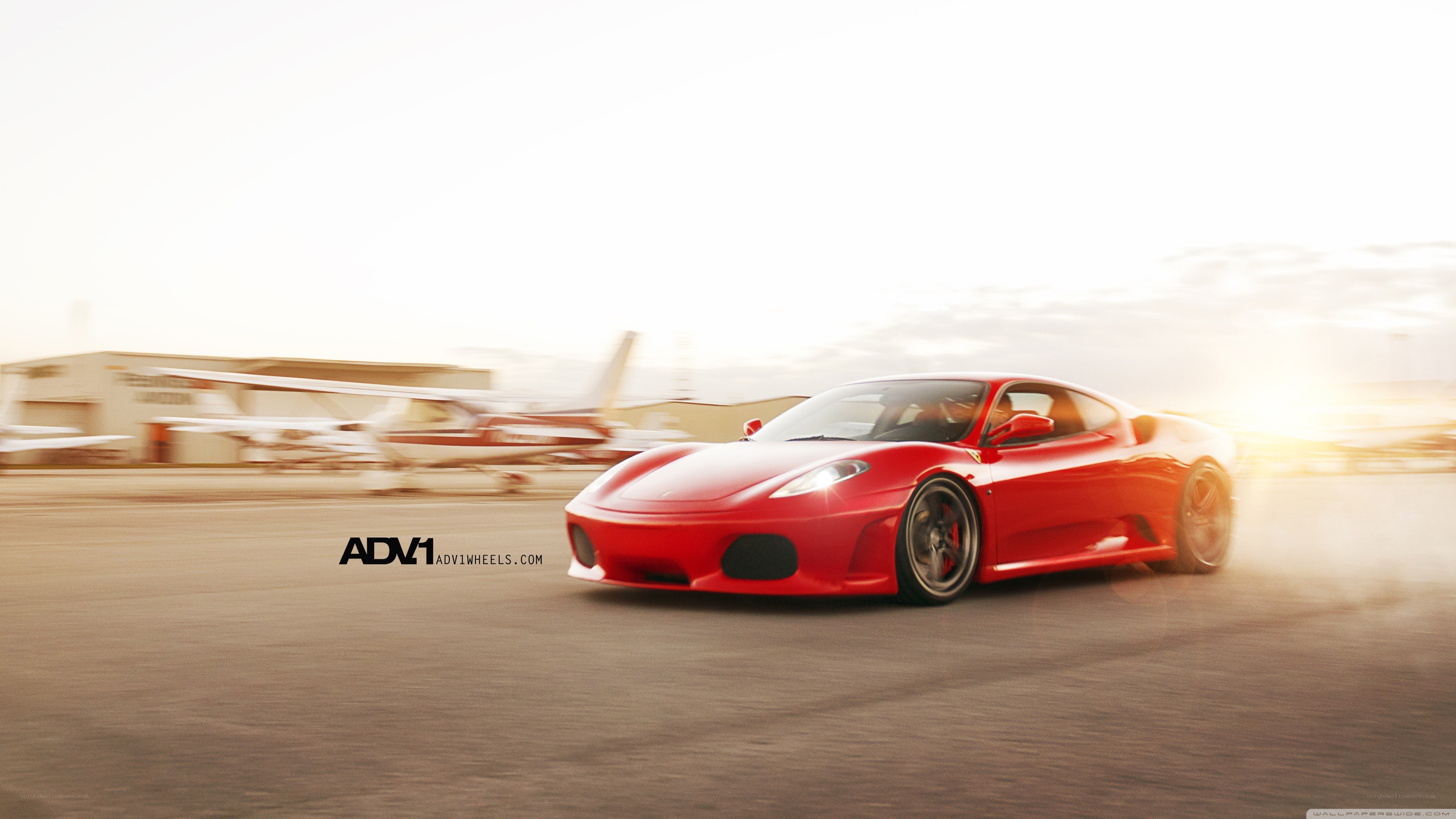 Red Ferrari on a runway