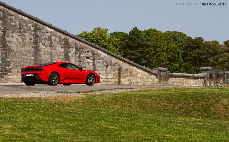 Red Ferrari on a stone bridge