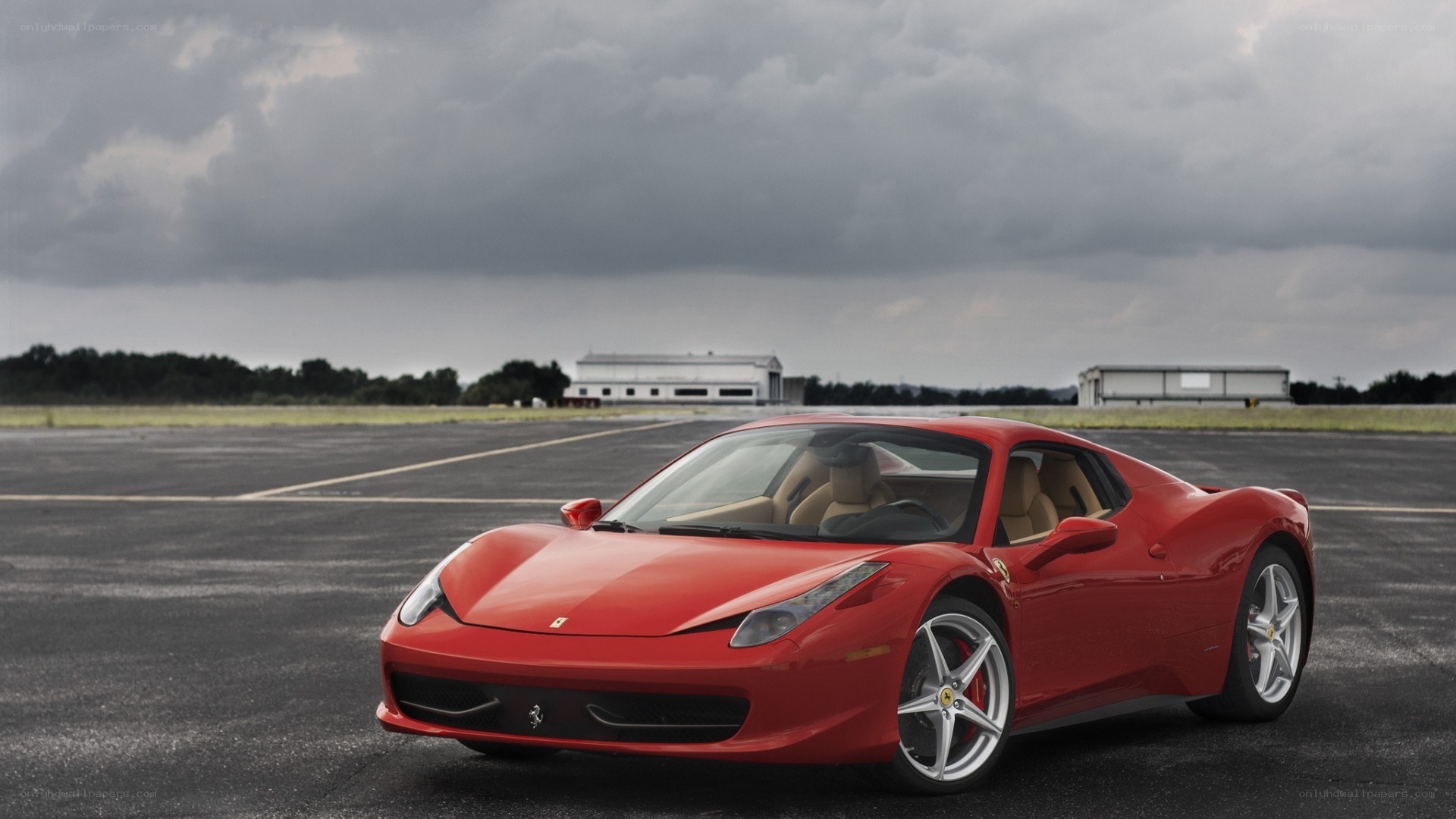 Red Ferrari on a tarmac