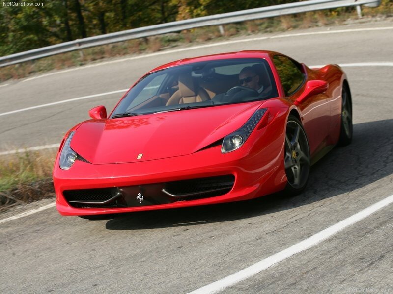 Red Ferrari on a winding road