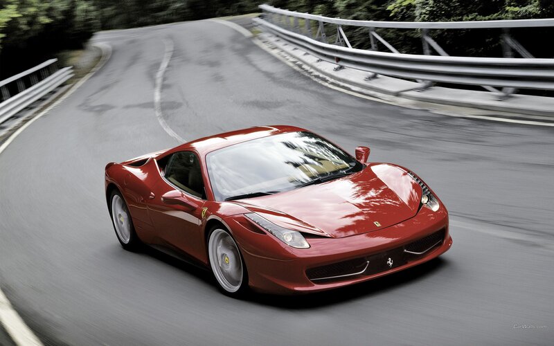 Red Ferrari on a winding road