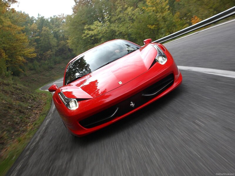 Red Ferrari on a winding road