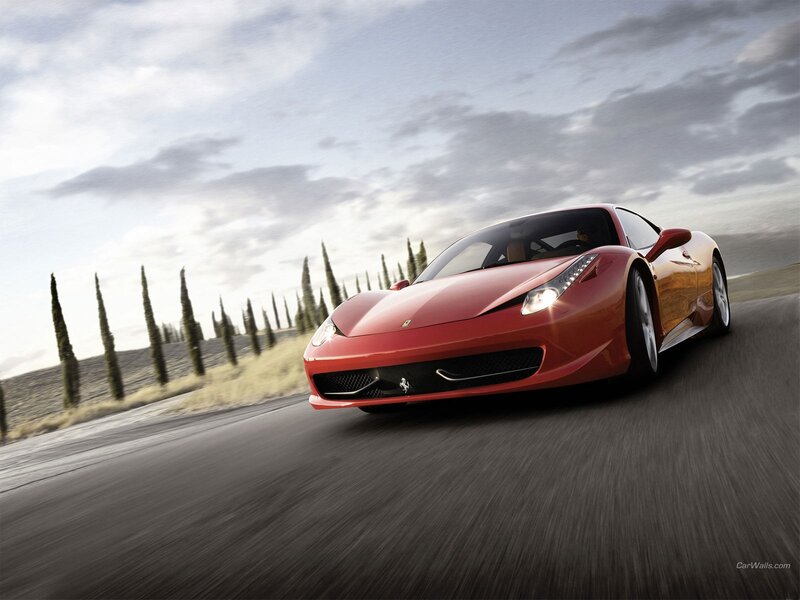 Red Ferrari on a winding road