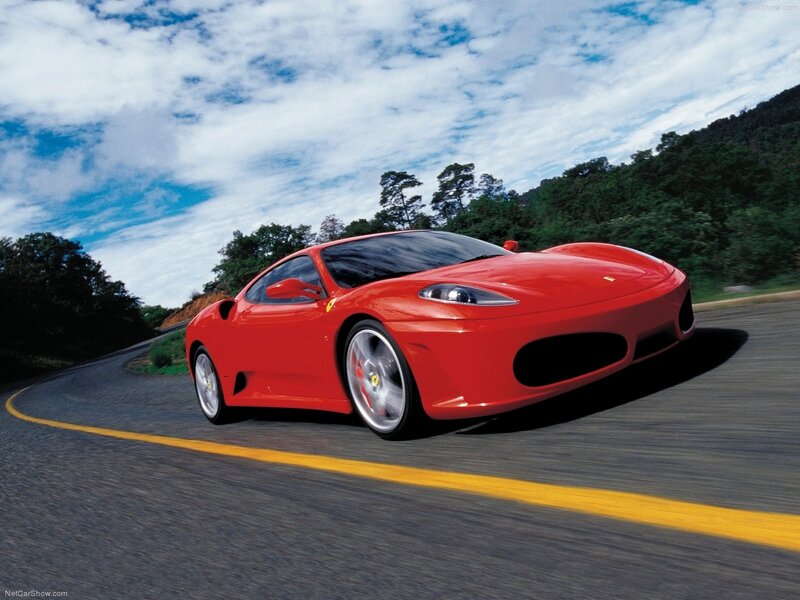 Red Ferrari on a winding road