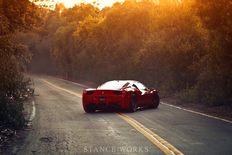 Red Ferrari on a winding road