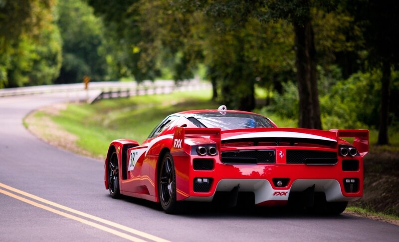 Red Ferrari on a winding road