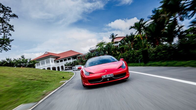 Red Ferrari on a winding road