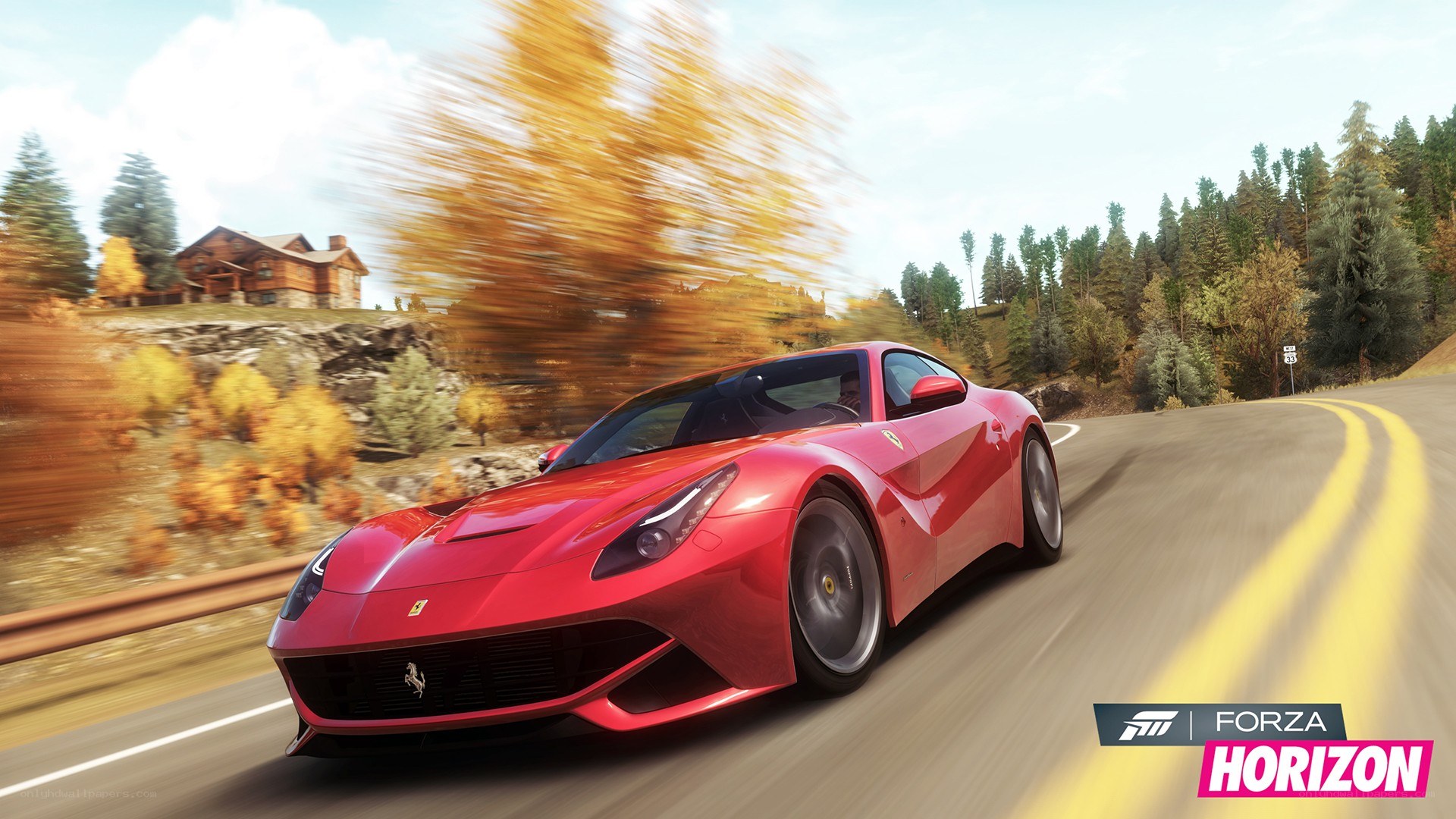 Red Ferrari on a winding road