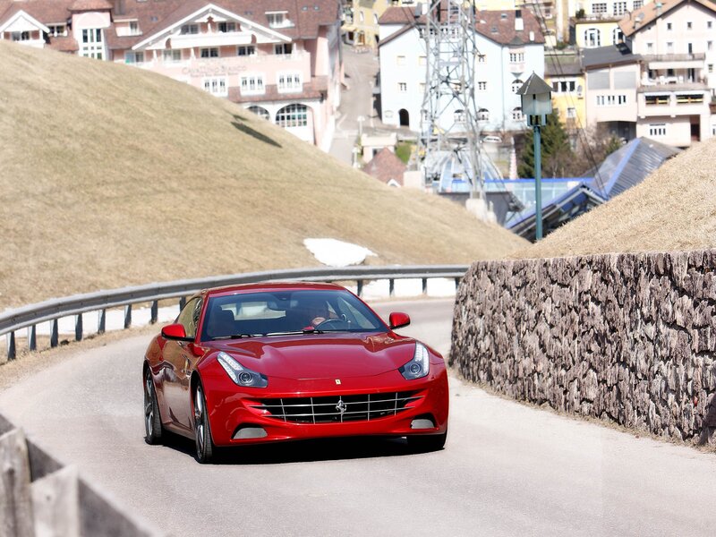 Red Ferrari on a winding road