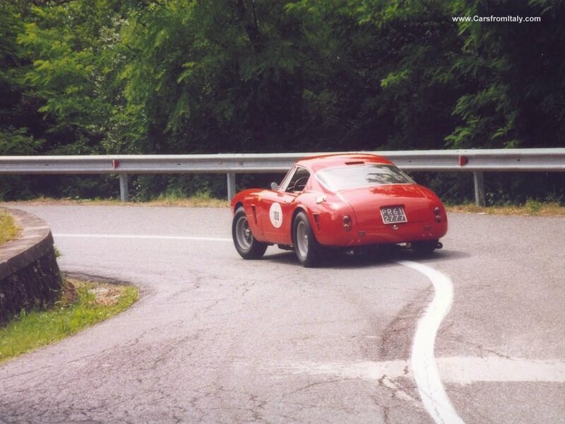 Red Ferrari on a winding road