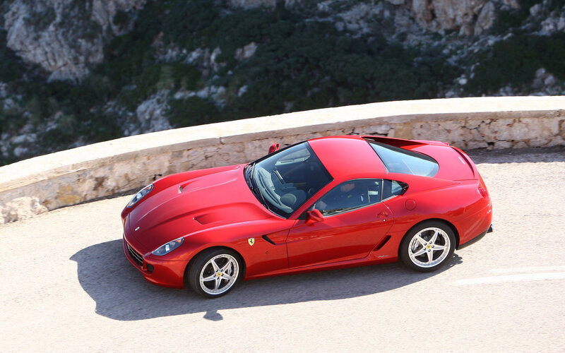 Red Ferrari on a winding road