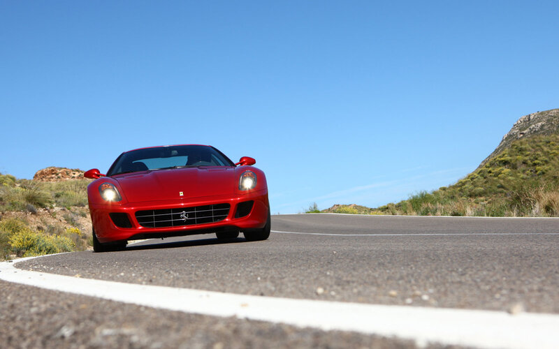 Red Ferrari on a winding road