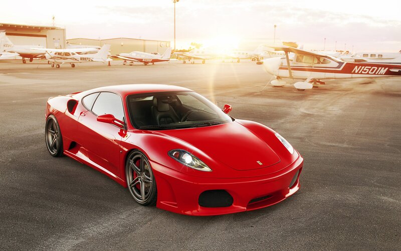 Red Ferrari on airfield