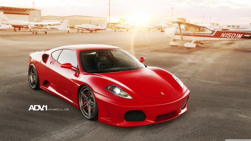 Red Ferrari on airfield