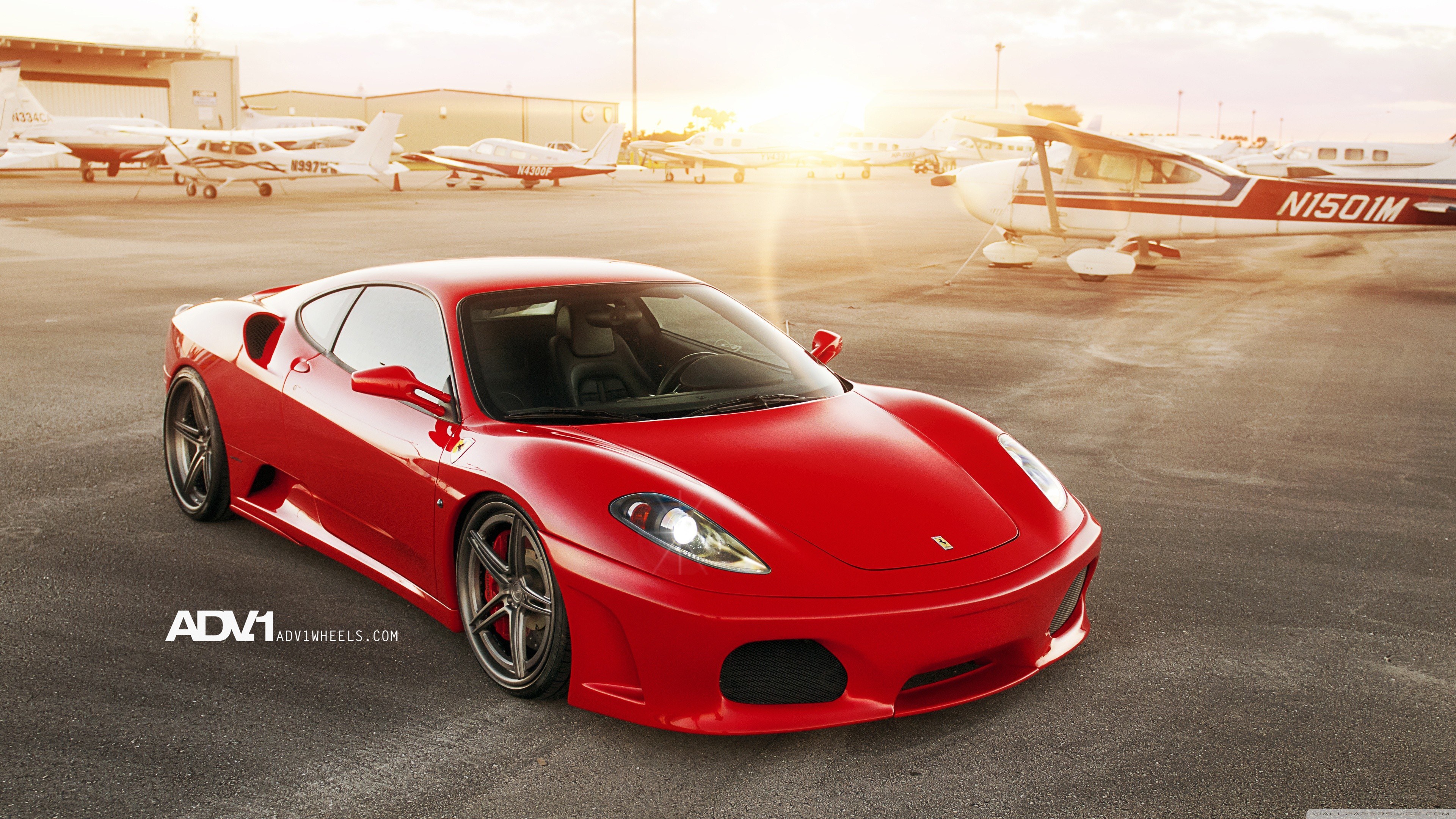 Red Ferrari on airfield