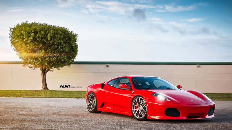 Red Ferrari on asphalt
