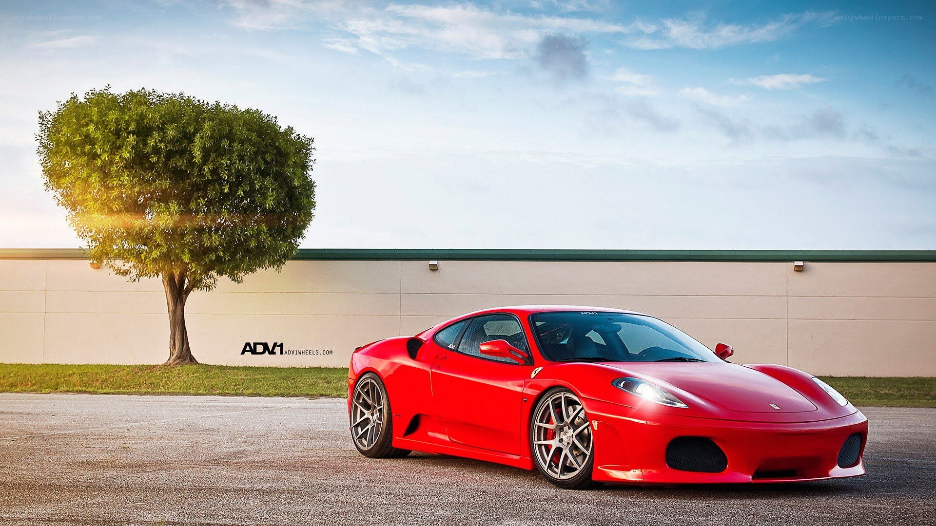 Red Ferrari on asphalt