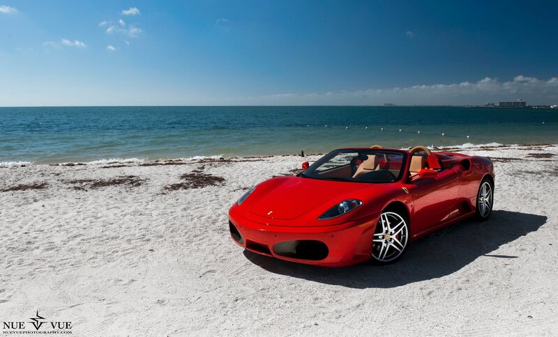 Red Ferrari on beach
