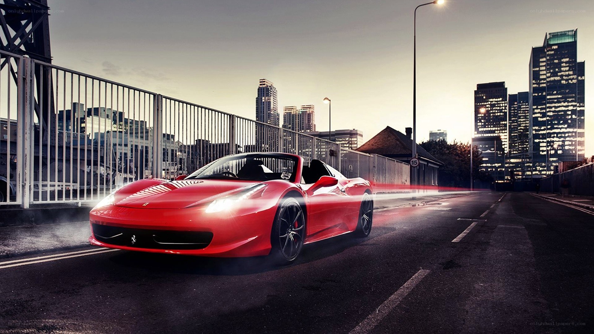 Red Ferrari on city bridge