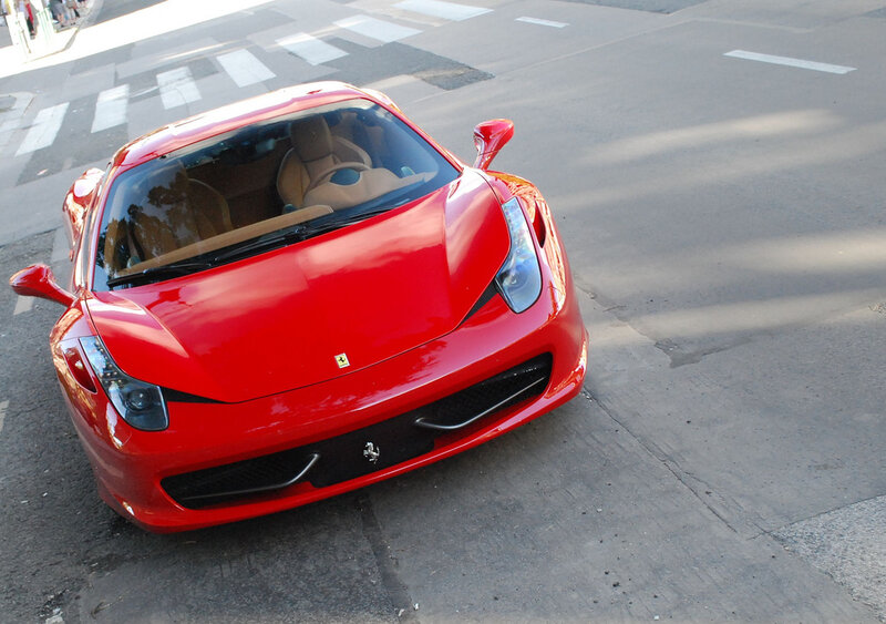 Red Ferrari on city street