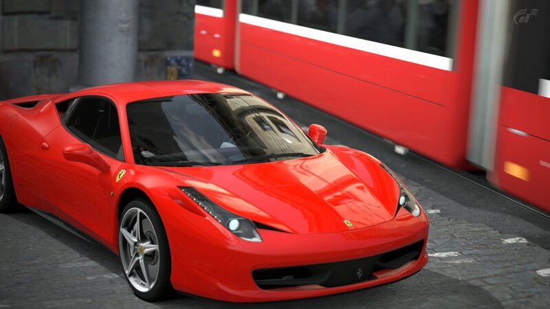 Red Ferrari on city street