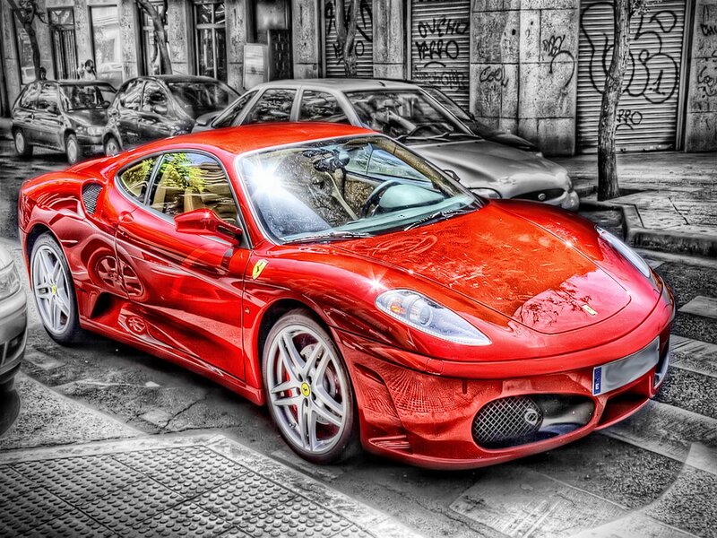 Red Ferrari on city street