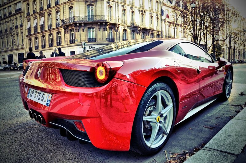 Red Ferrari on city street