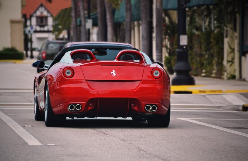 Red Ferrari on city street