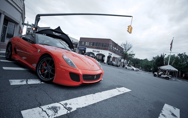 Red Ferrari on city street
