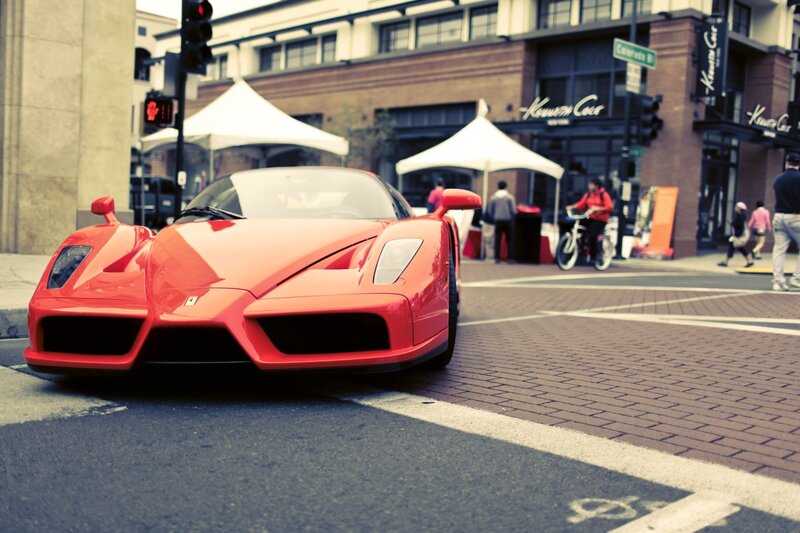 Red Ferrari on city street