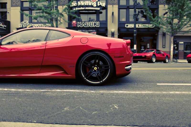 Red Ferrari on city street